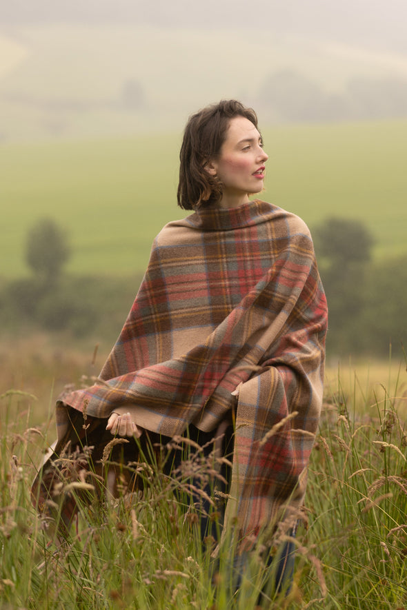 Great Scot Auld Royal Stewart Tartan in their Braemar Poncho worn by royalty and celebs.
